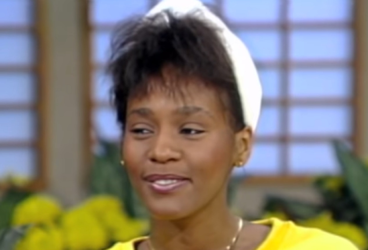 Screenshot of Whitney Houston is smiling and looking at side - from Whitney (2018)