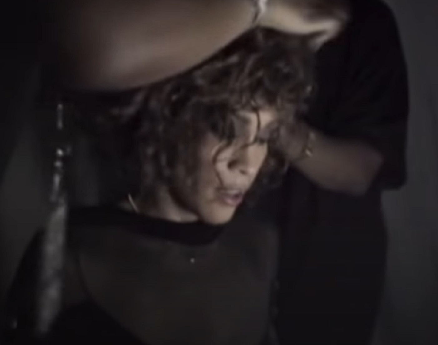 Screenshot of Whitney Houston is looking down with sad face - from Whitney (2018)