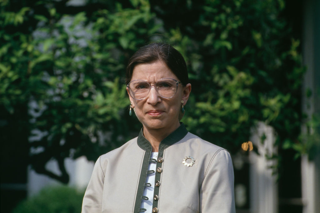 Portrait of newly confirmed US Supreme Court Justice Ruth Bader Ginsburg as she speaks to the press in the Rose Garden at the White House in gray suit