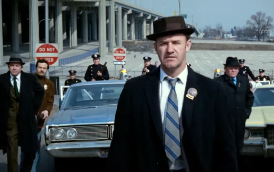 Gene Hackman in The French Connection, in suit and police badge