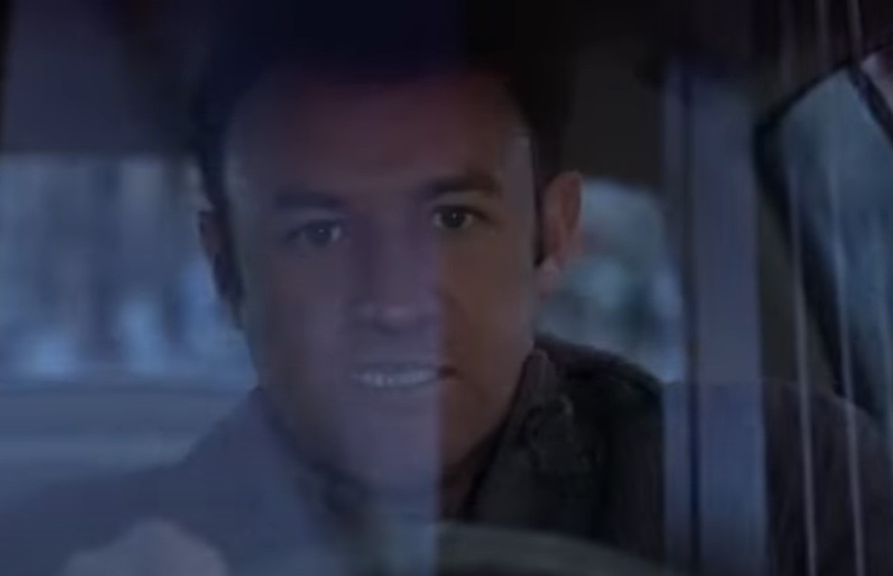 Gene Hackman in The French Connection, in suit driving a car