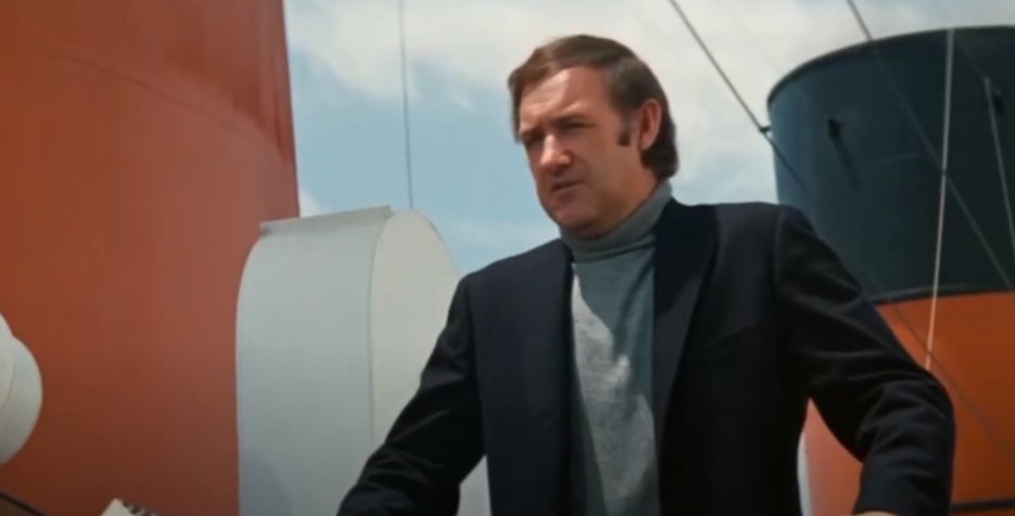 Gene Hackman in The Poseidon Adventure, wearing jacket and turtleneck