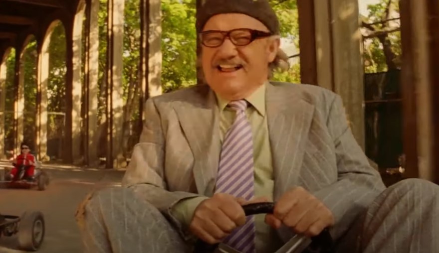 Gene Hackman in The Royal Tenenbaums in suit driving Go-kart