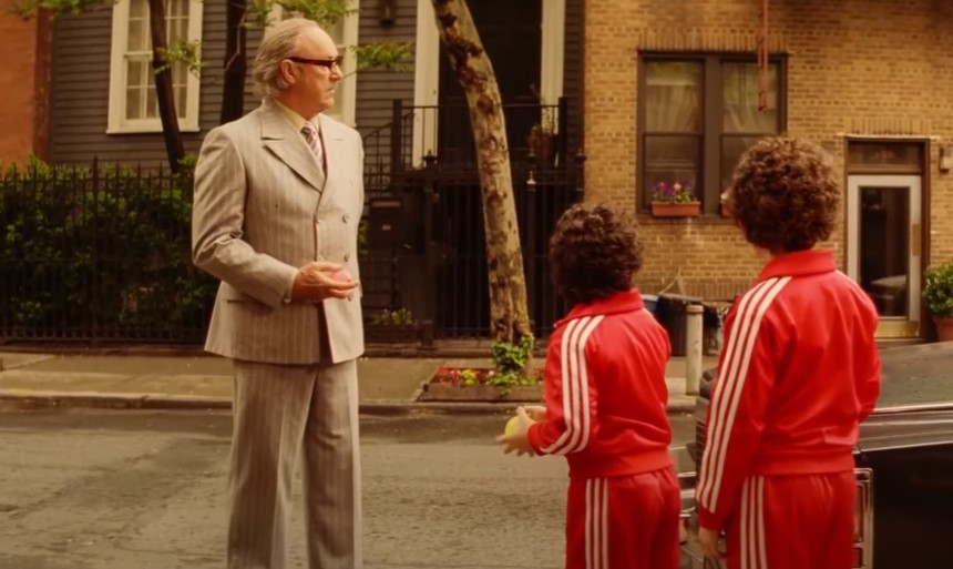 Gene Hackman in  The Royal Tenenbaums in suit playing with the kids
