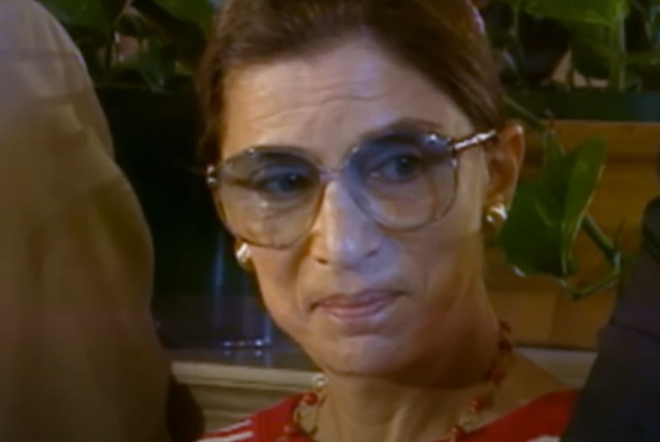 Ruth Bader Ginsburg in red sweater and jewelry at an event