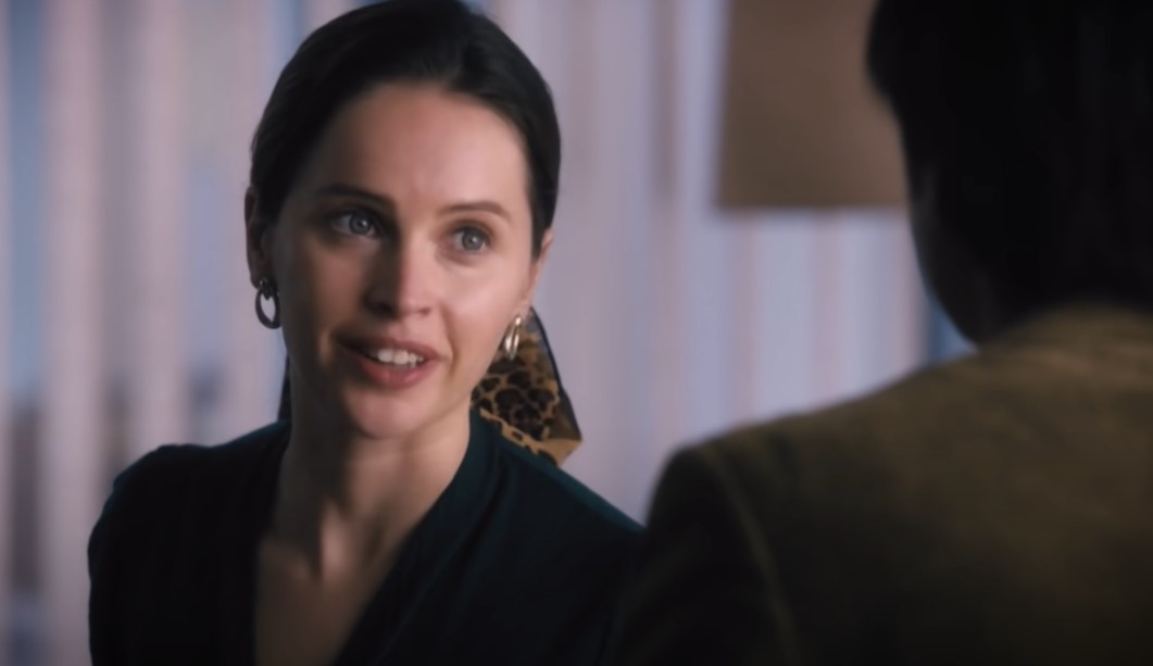 Felicity Jones as Ruth Bader Ginsburg in black top and earrings