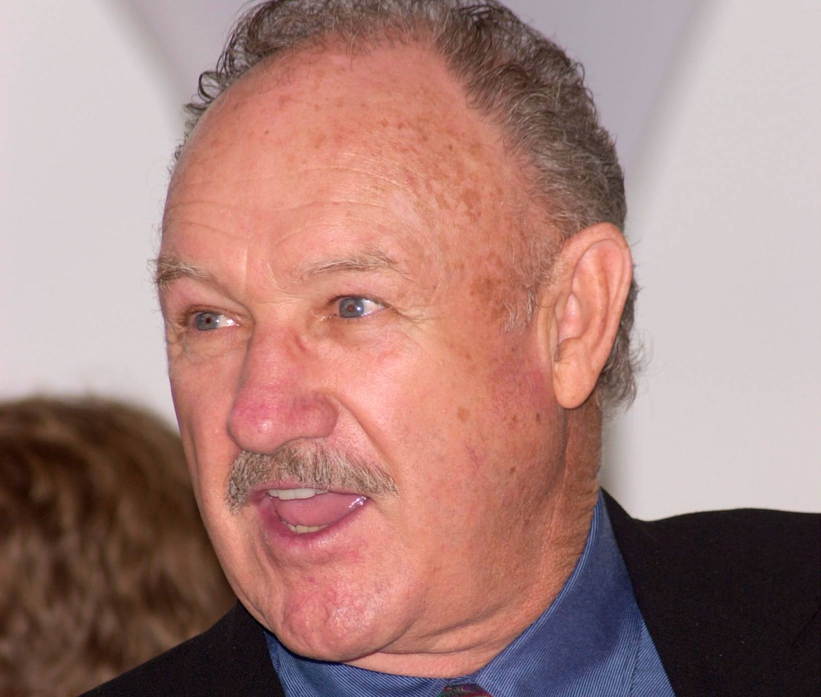 Actor GENE HACKMAN at the Cannes Film Festival to promote his new movie Under Suspicion in suit and tie looking left yelling