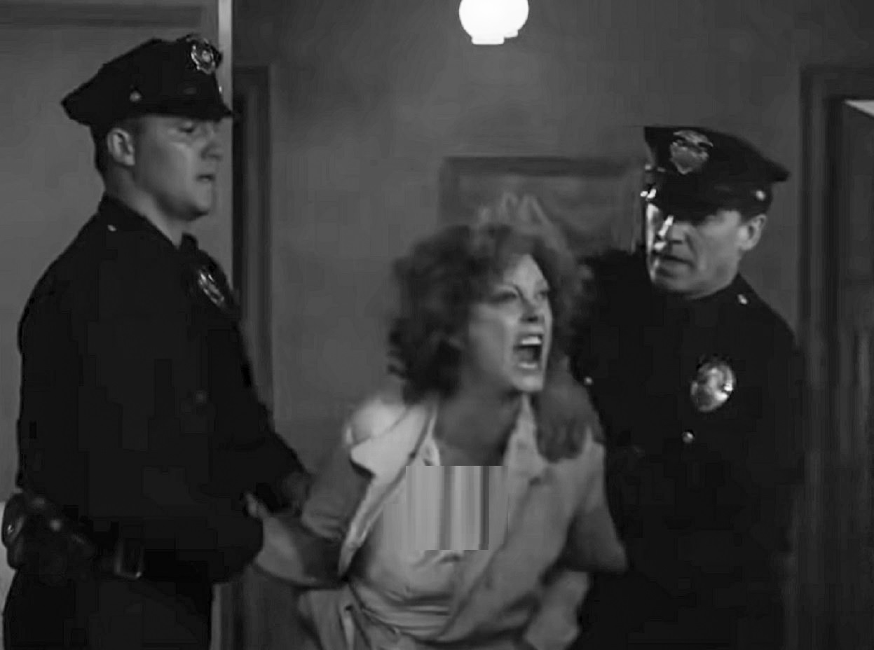 Screenshot: Gladys Pearl Baker (Susan Sarandon) is hold down by police officers - from The Secret Life of Marilyn Monroe (2015)