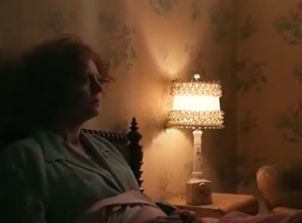 Screenshot: Gladys Pearl Baker (Susan Sarandon) is laying in bed and thinking - from The Secret Life of Marilyn Monroe (2015)