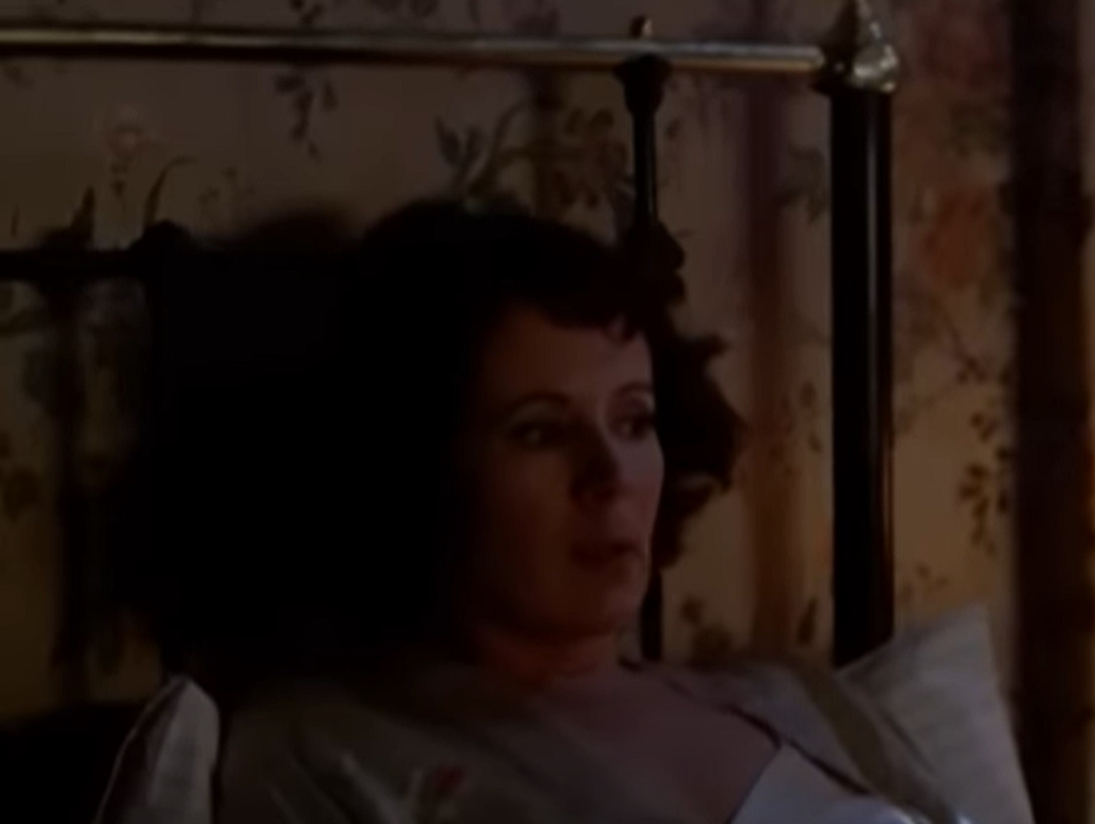 Screenshot: Gladys Pearl Baker (Patricia Richardson) is laying on the bed with sad face - from Blonde (2001)