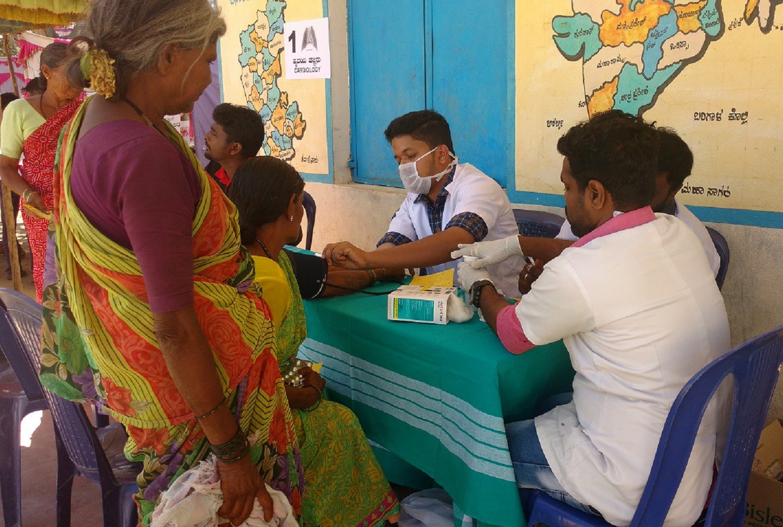 Street doctor is working with patients in rural area.