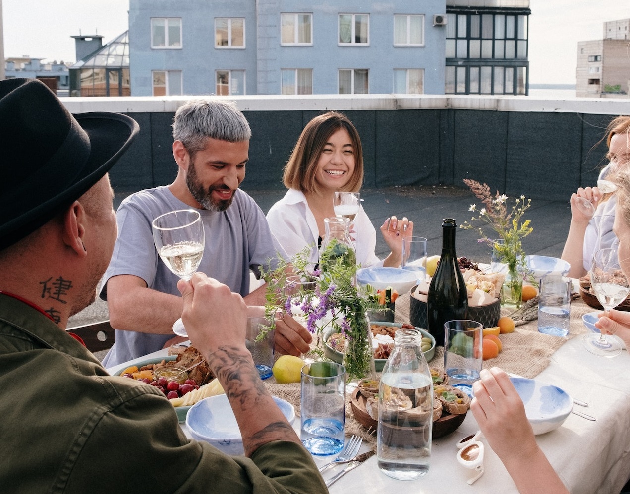 Young people are having a lunch at rooftop.