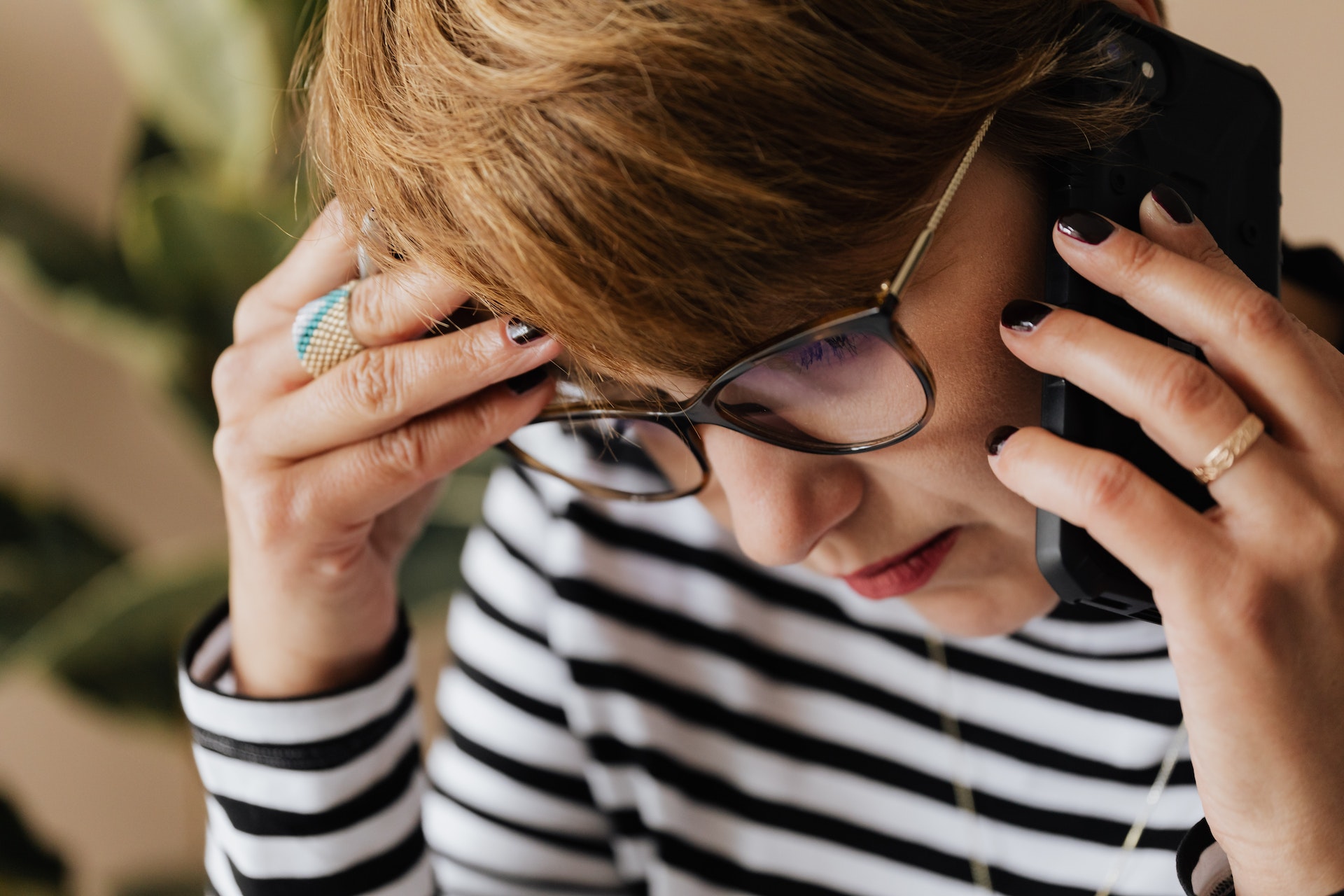 anxious woman having phone conversation