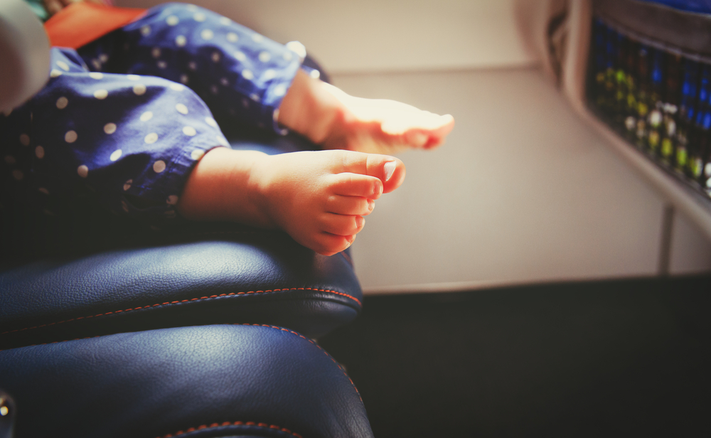 little baby traveling by plane