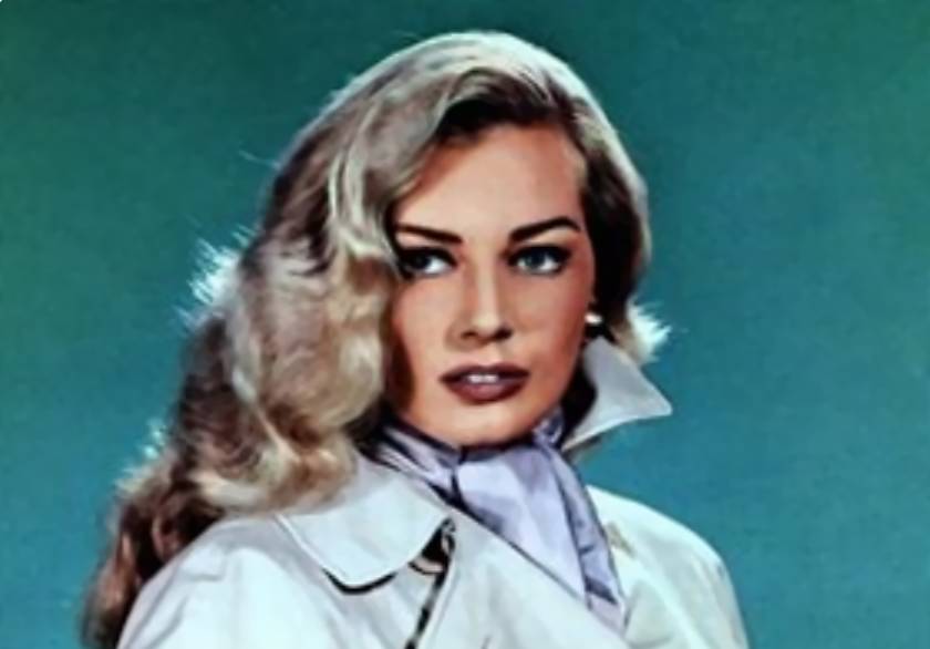 Anita Ekberg in trench coat and earrings