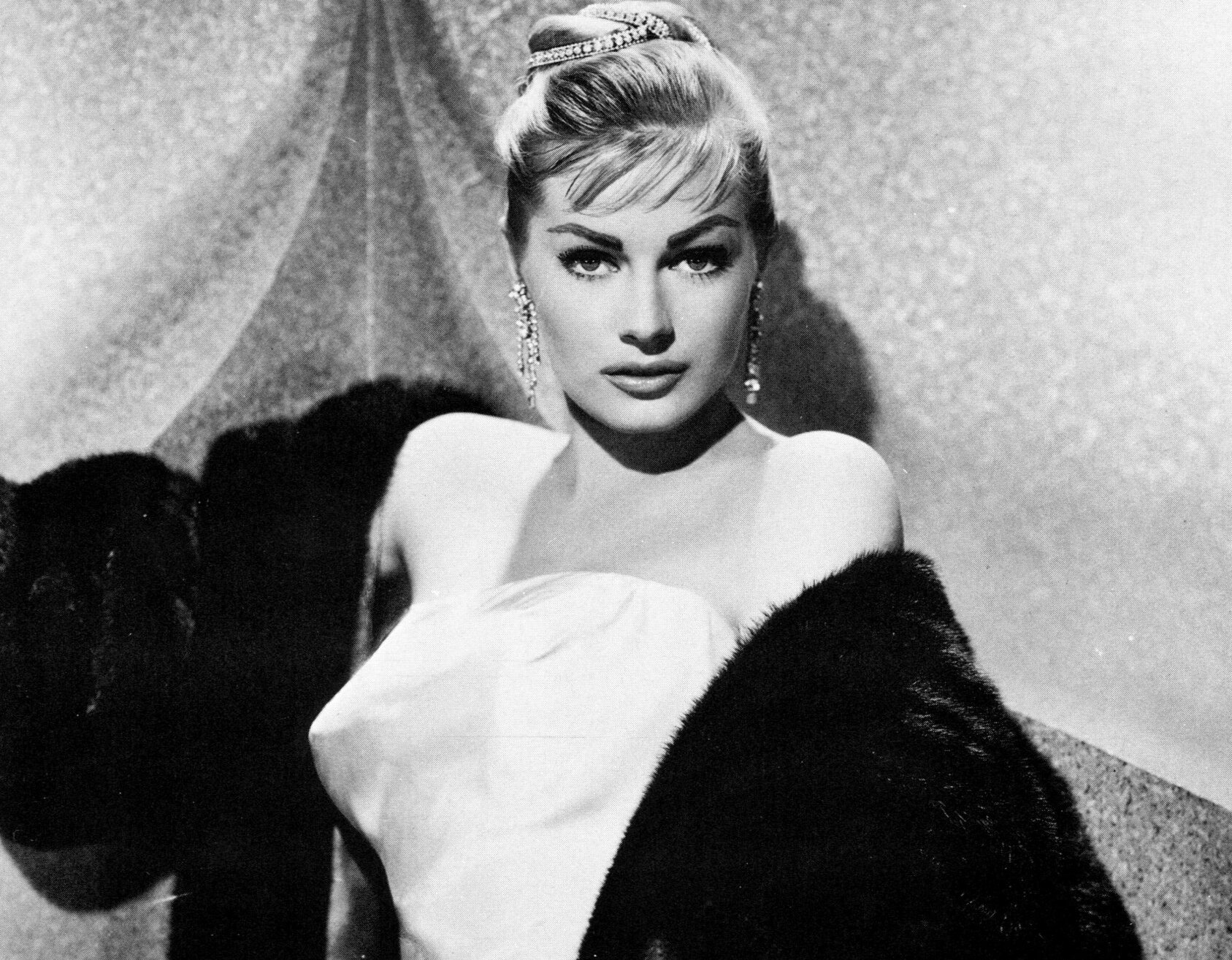 Anita Ekberg in white dress,  fur coat and  earrings