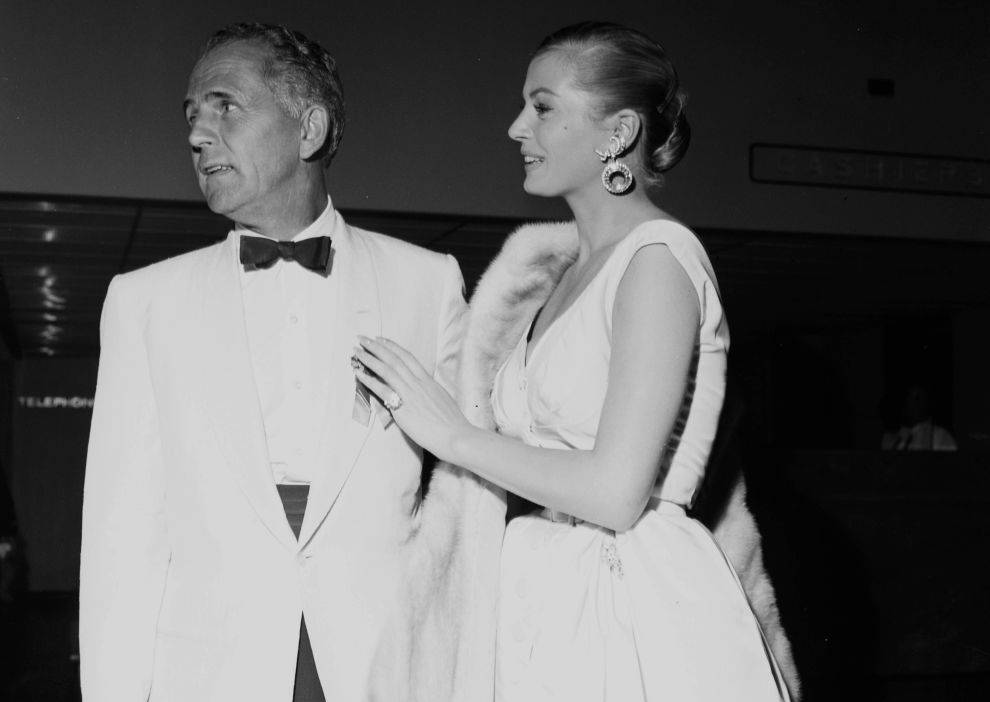 Actress Anita Ekberg  in white dress and earrings