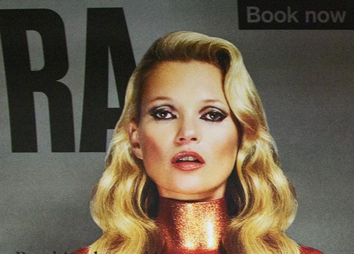 Kate Moss is wearing golden dress and looking at camera - 2014