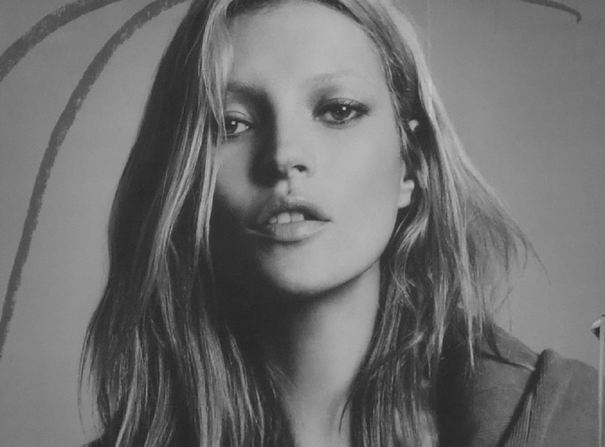 B&W photo of Kate Moss wearing grey jacket and looking at camera - 2006