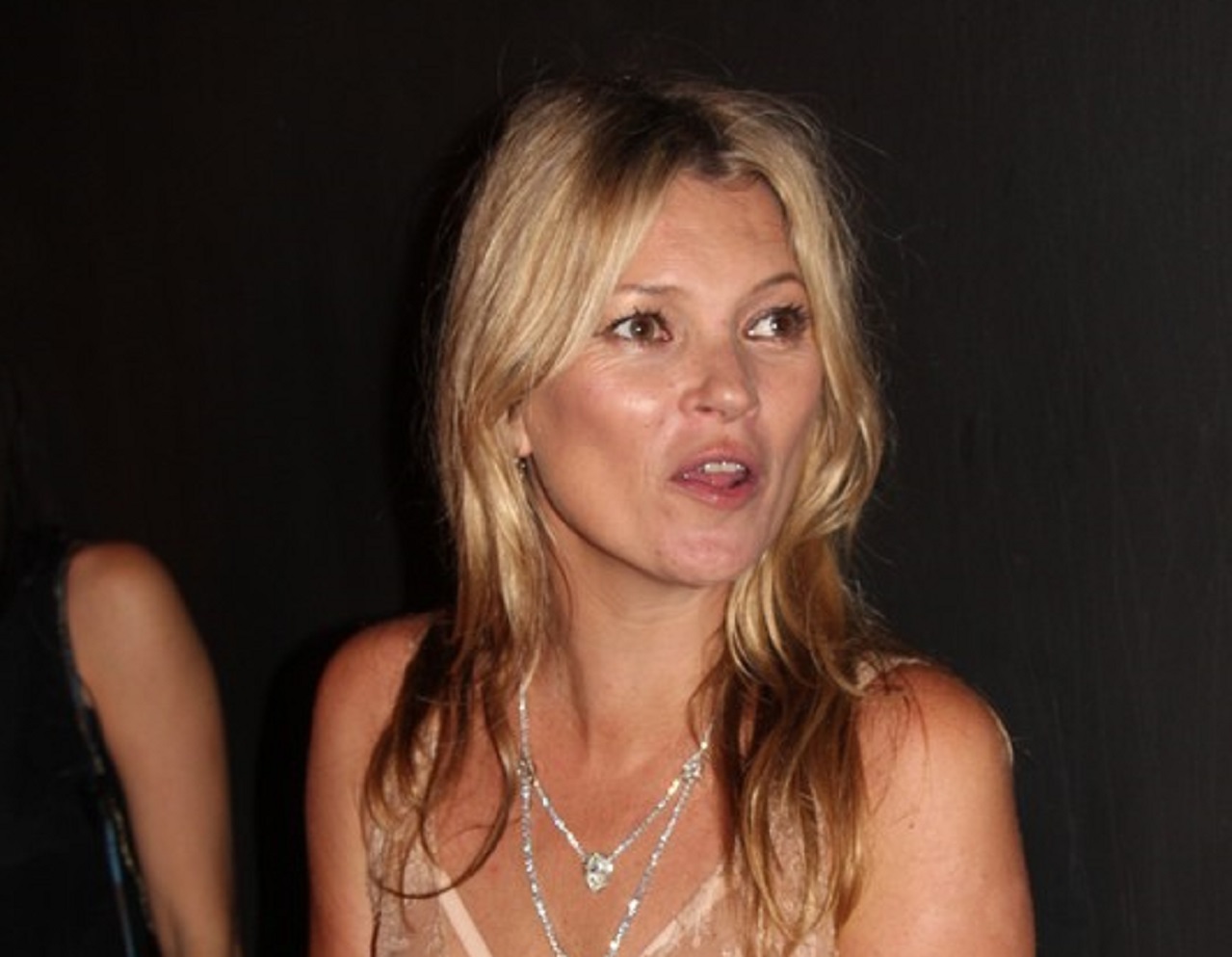 Kate Moss is looking at side and talking - 2015