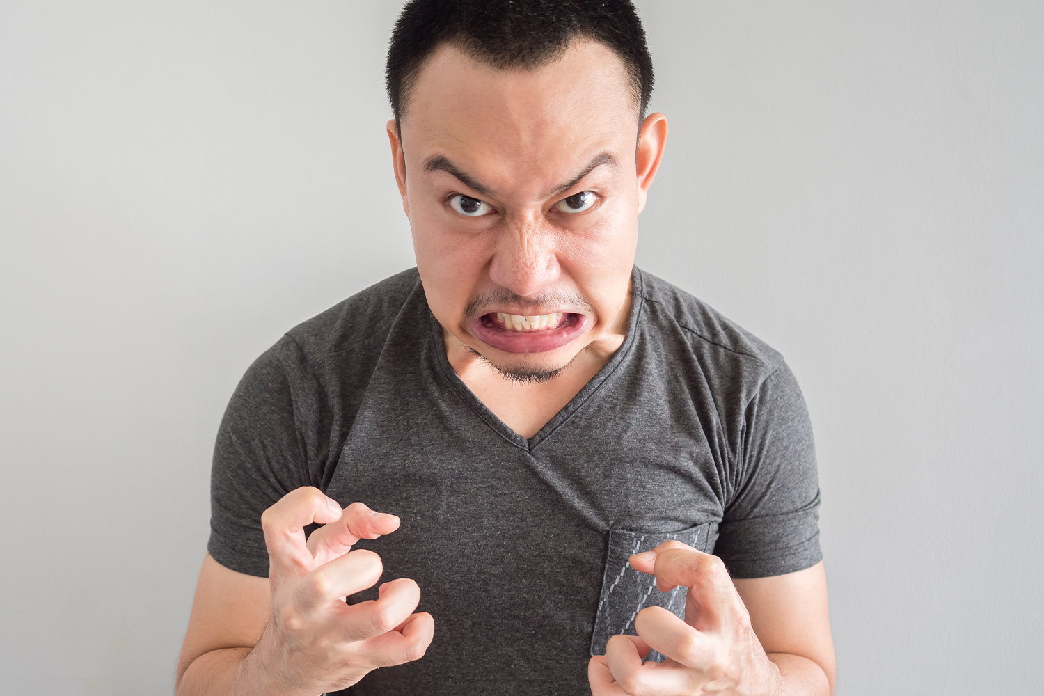 Angry Asian Man Wearing A Grey T-Shirt