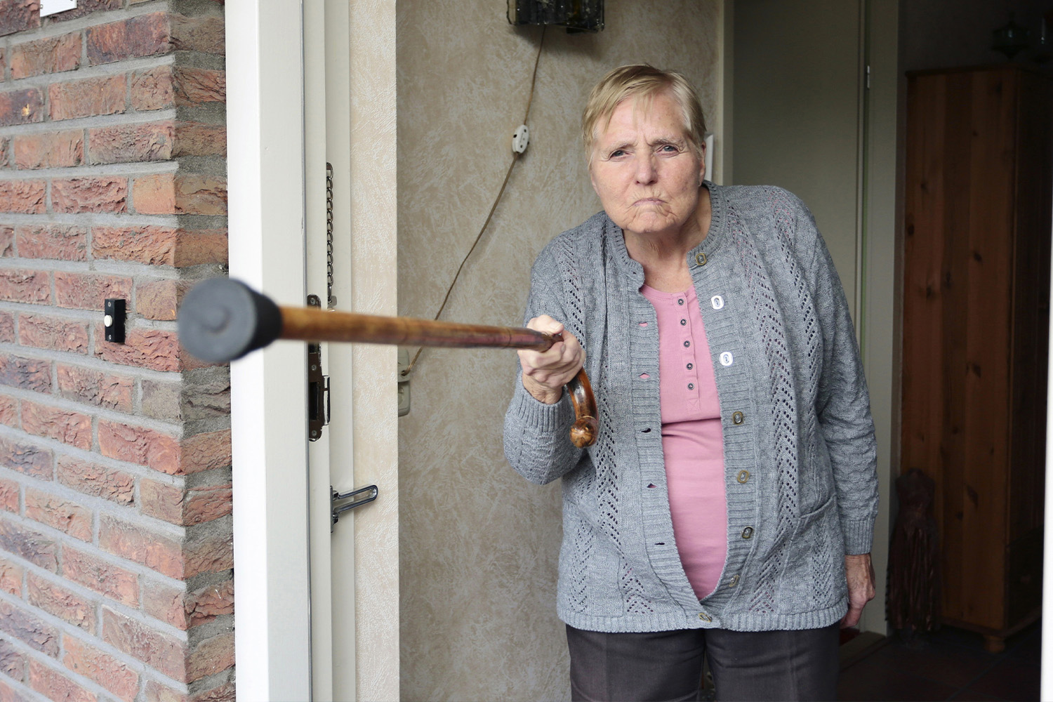 Angry Old Lady Pointing A Cane