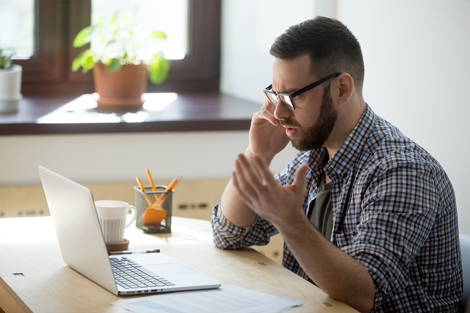 Confused Man Looking At His Computer