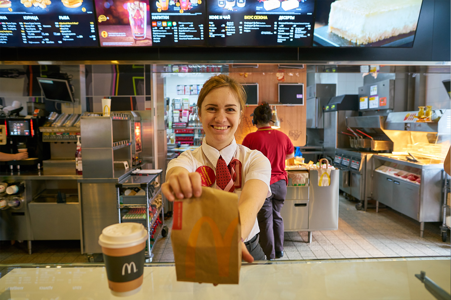 Mcdonalds Employee Serving A Meal