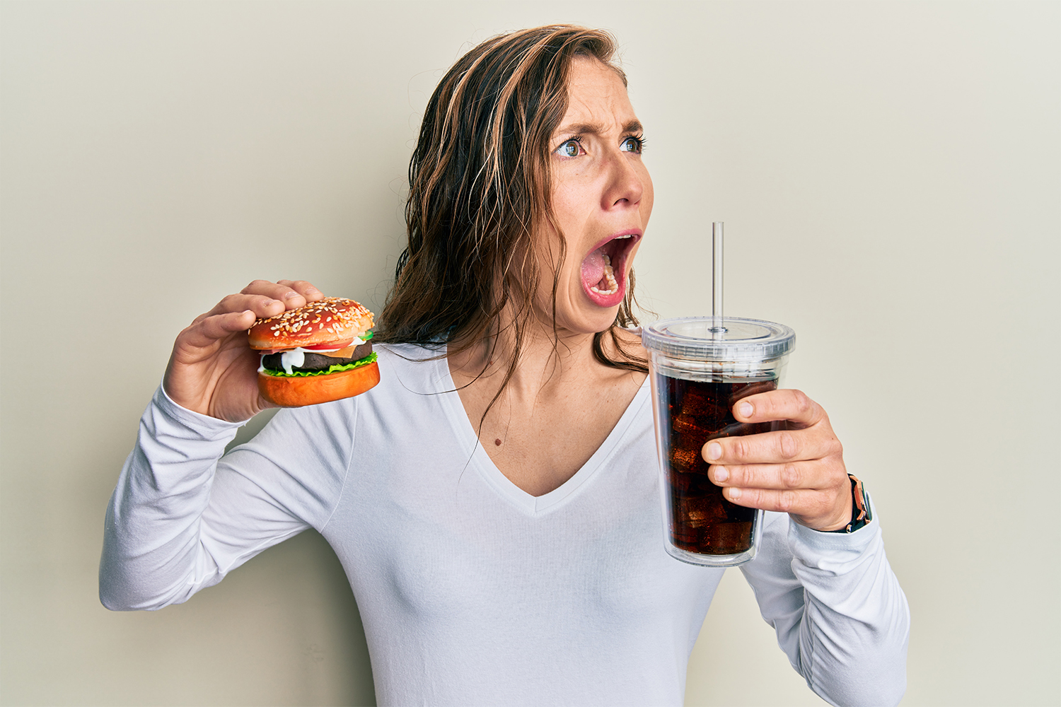 Shocked Woman Holding Fast Food