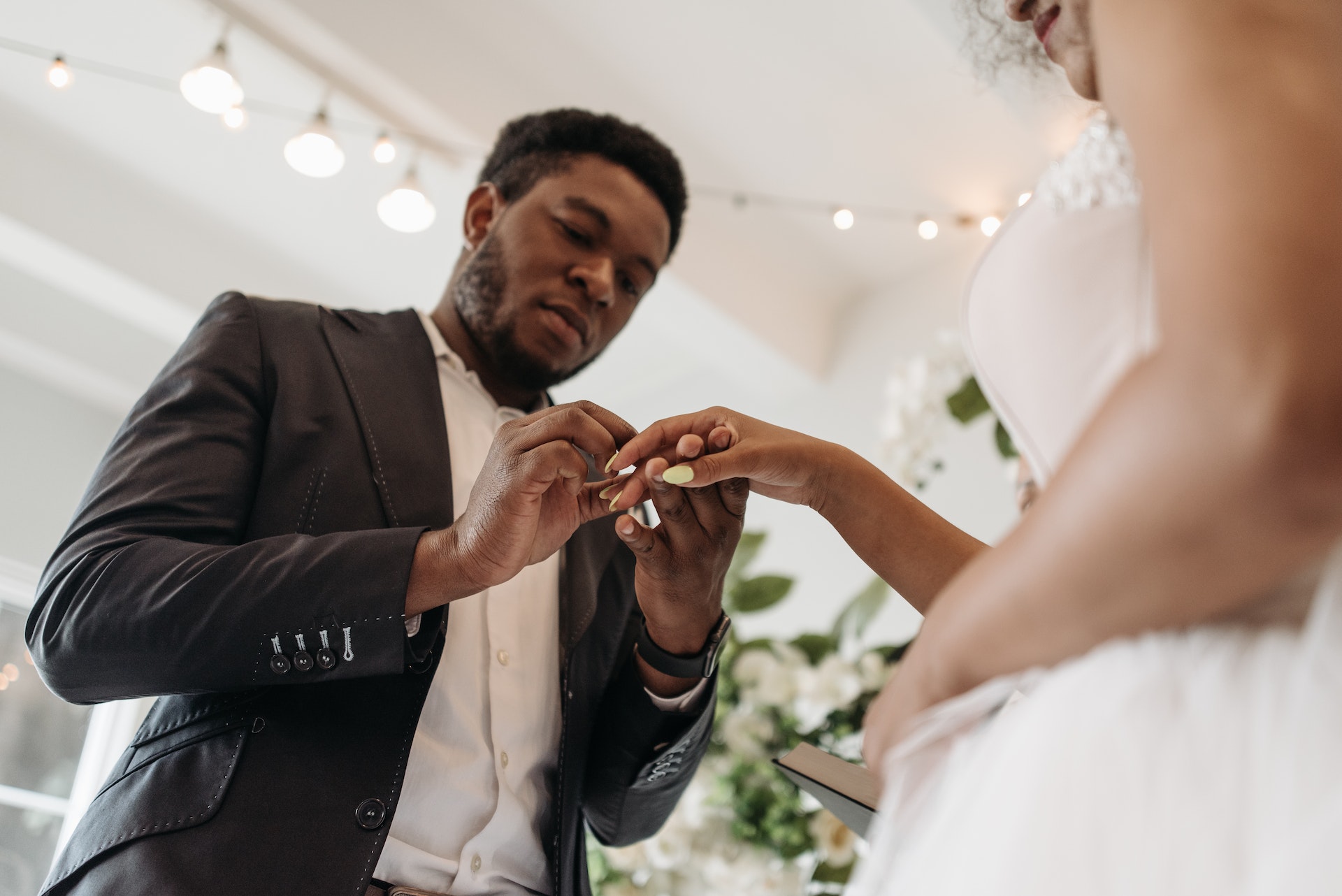 Couple exchanging rings at their church wedding