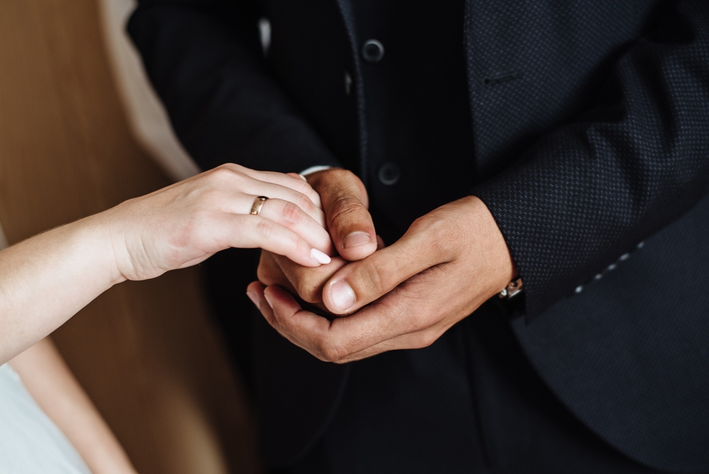 bride and groom holding hands