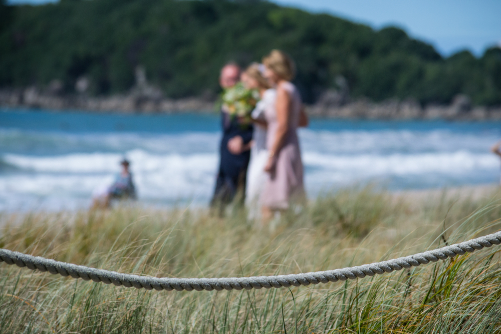 Bride and mother in law walk down on the aisle