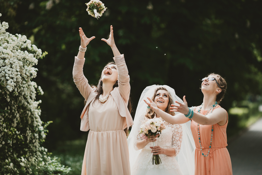 bouquet toss at a wedding