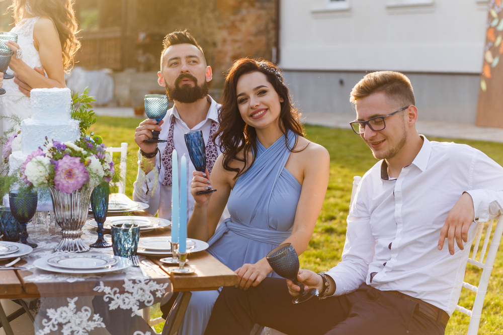 Wedding guests sitting at the table drinking