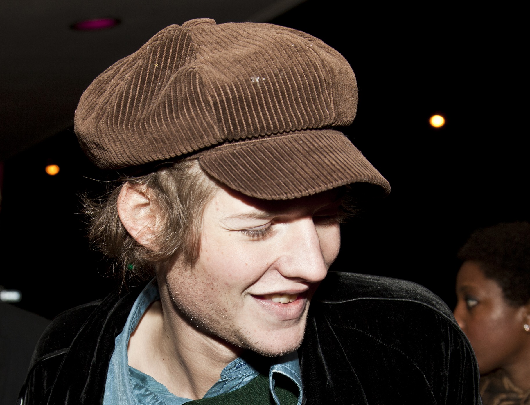 Nikolai von Bismarck wearing brown hat is looking at side and smiling - 2010