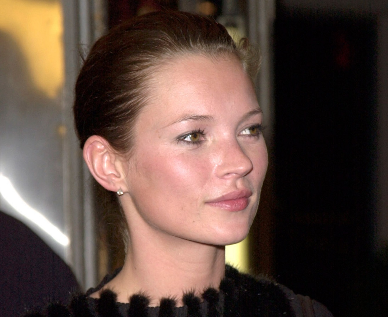 Kate Moss wearing black dress and smiling - 1999