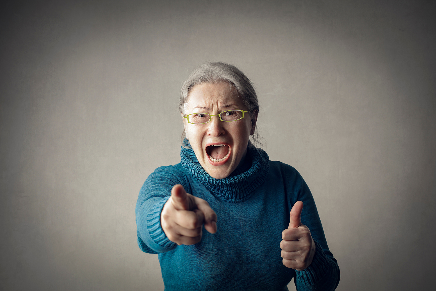 Angry Old Woman Pointing At The Camera