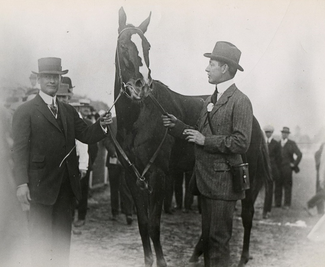 Regret (the horse) with trainer James Rowe (left) and owner Harry Payne Whitney. - 1915