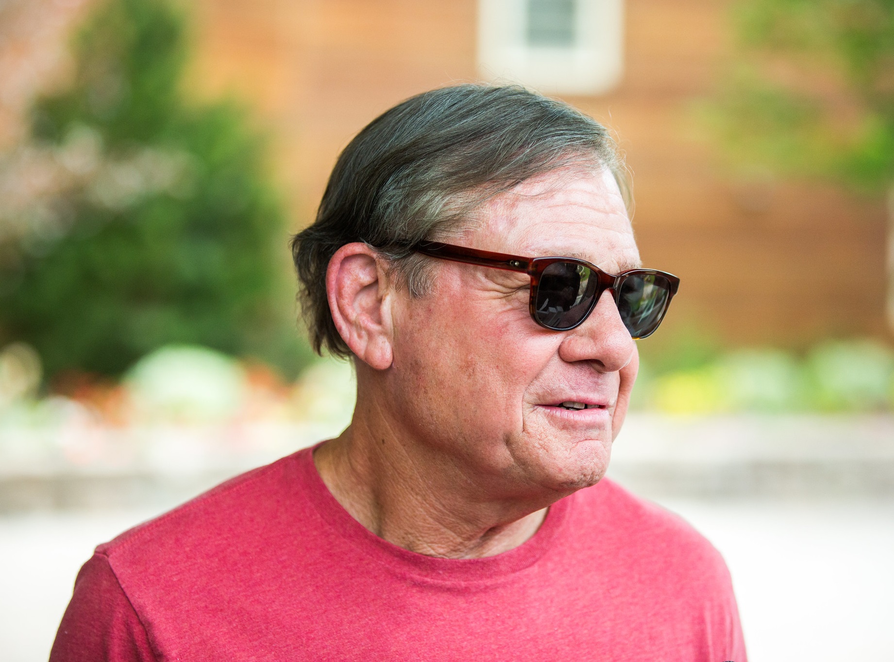 Mike Ovitz is looking at side and talking - 2015