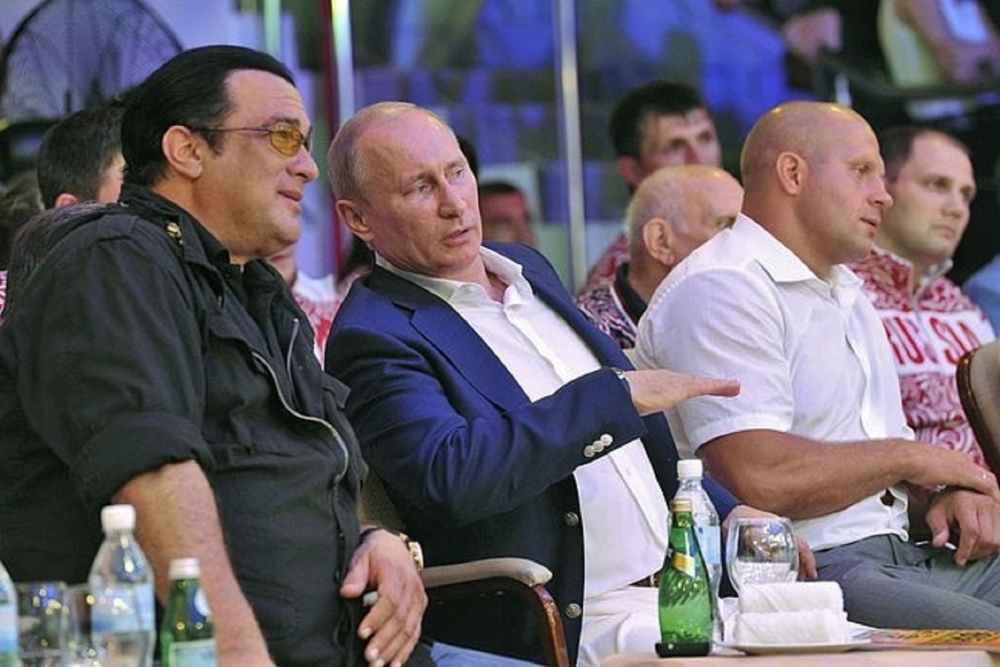 Steven Seagal is seating next to Vladimir Putin , having a conversation - 2012