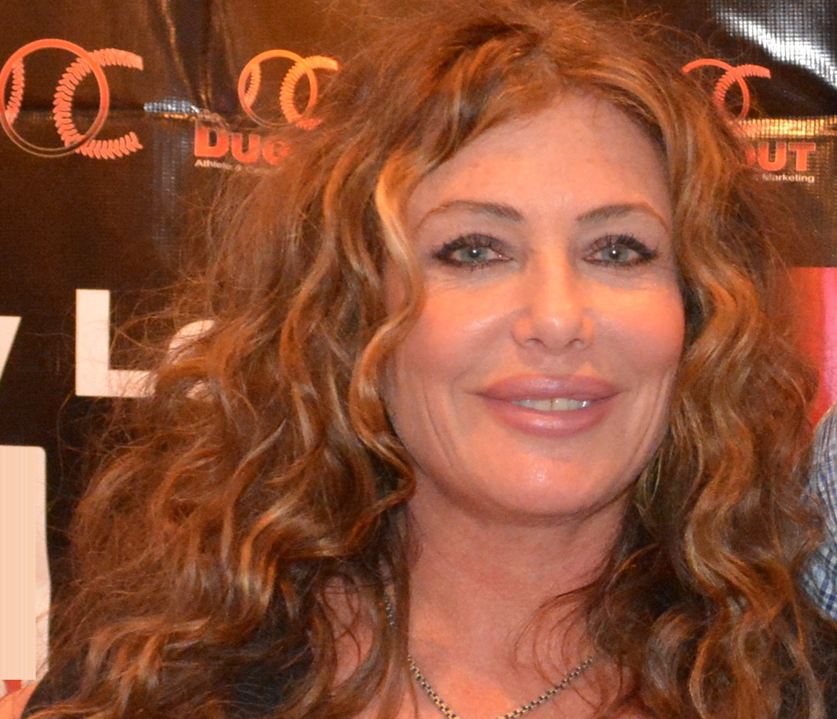 Kelly LeBrock is looking and smiling at camera - 2014