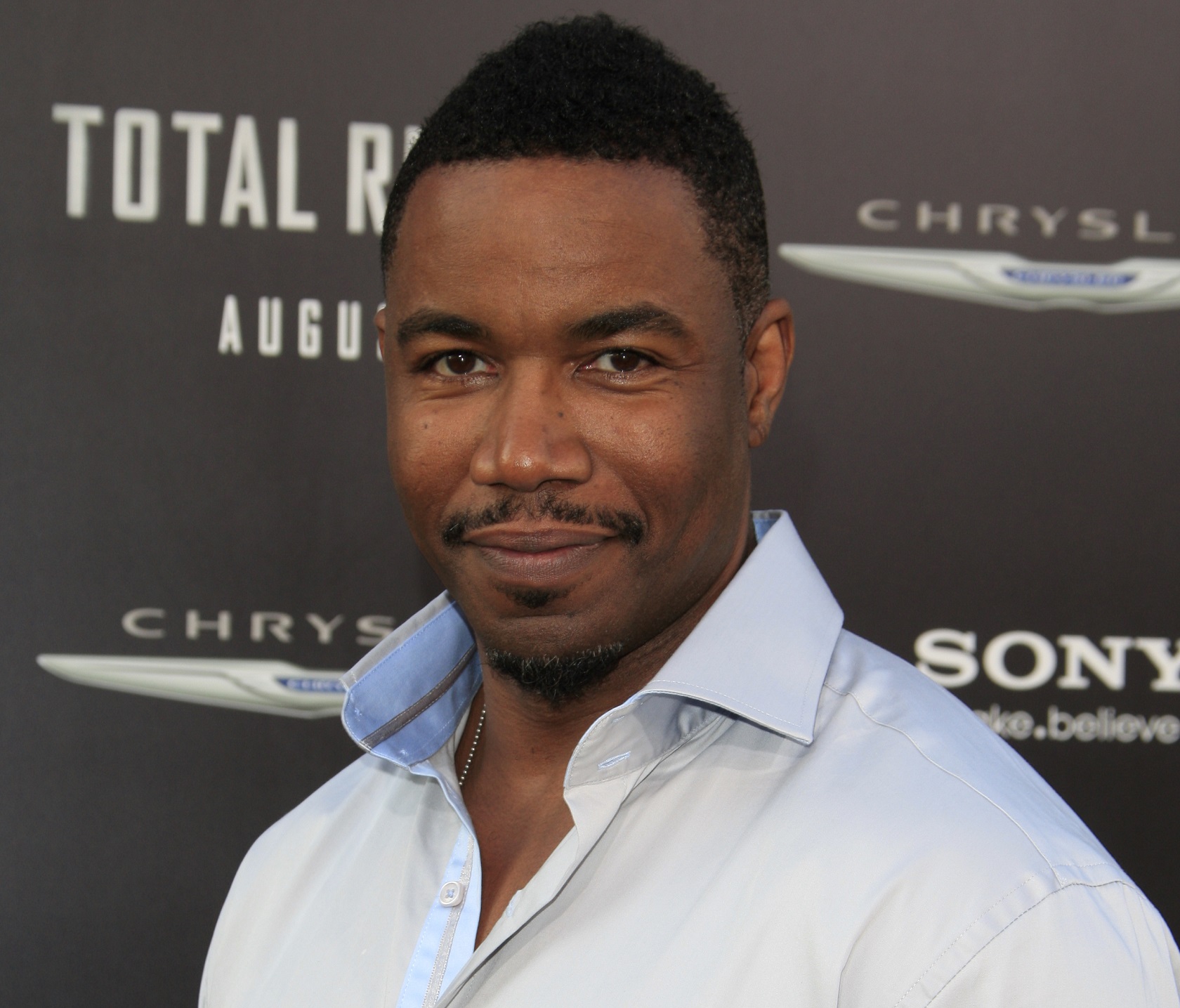 Michael Jai White in white shirt is looking at camera - 2012
