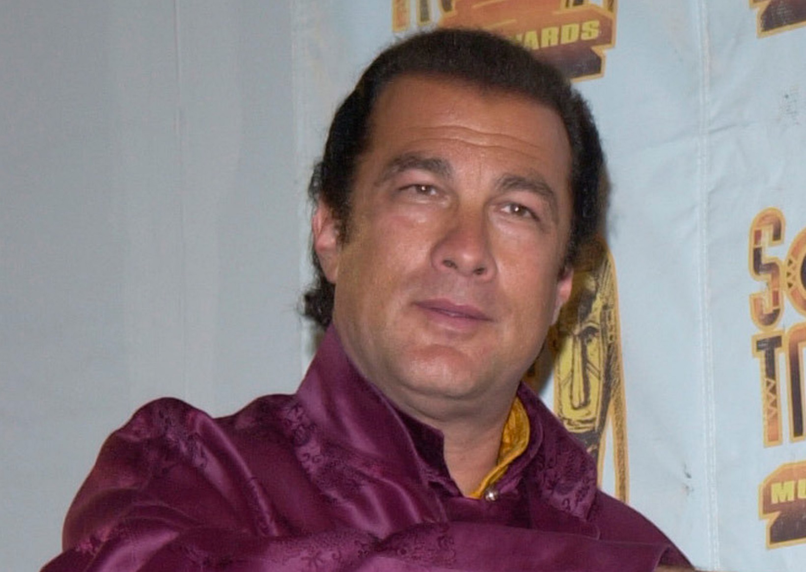 Steven Seagal is smiling and looking at front - 2001