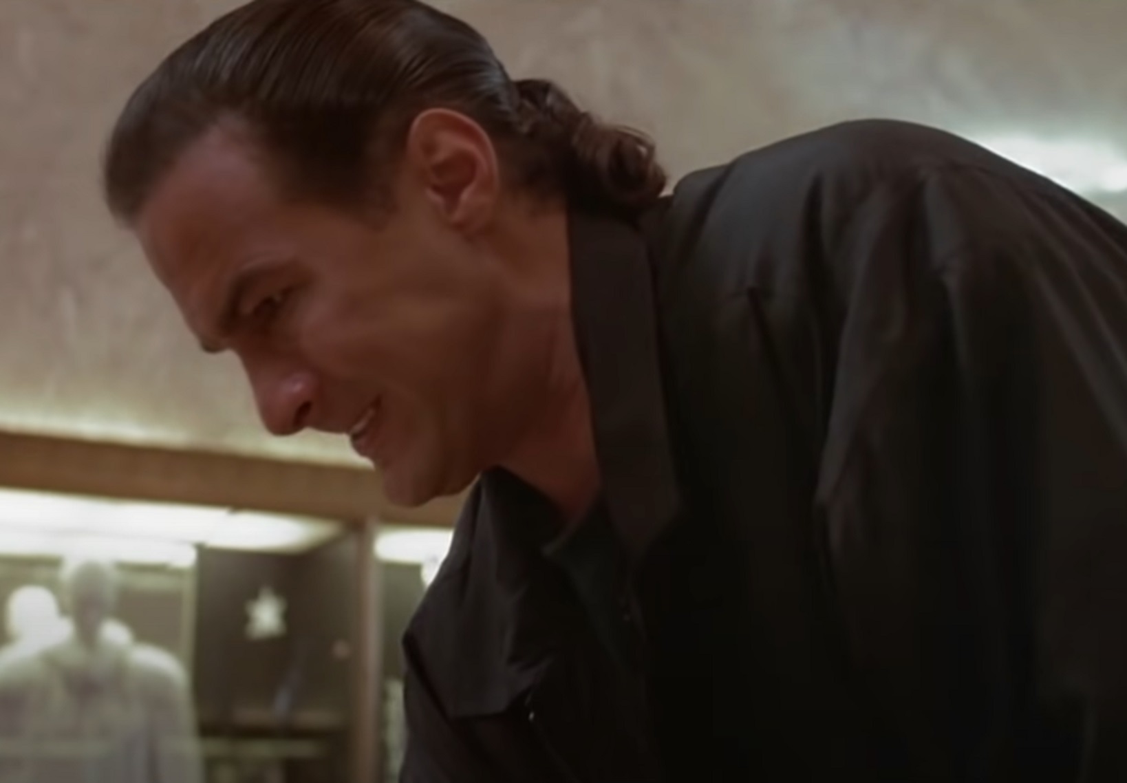 Screenshot: Steven Seagal is looking at down with angry face - from Marked For Death (1990).