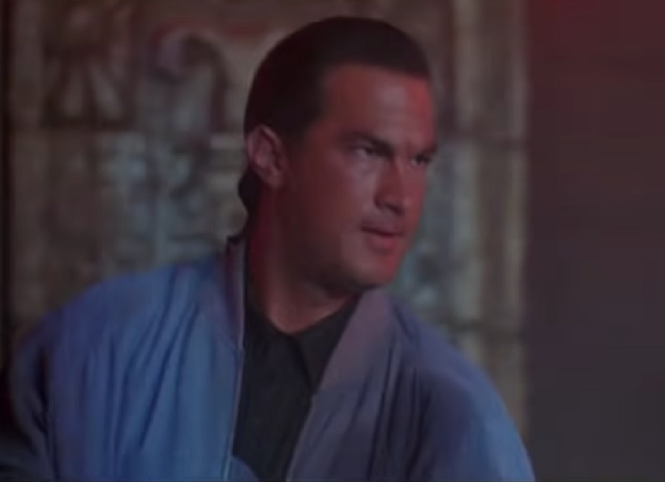 Screenshot: Steven Seagal is looking at side with upset face  - from Marked For Death (1990)