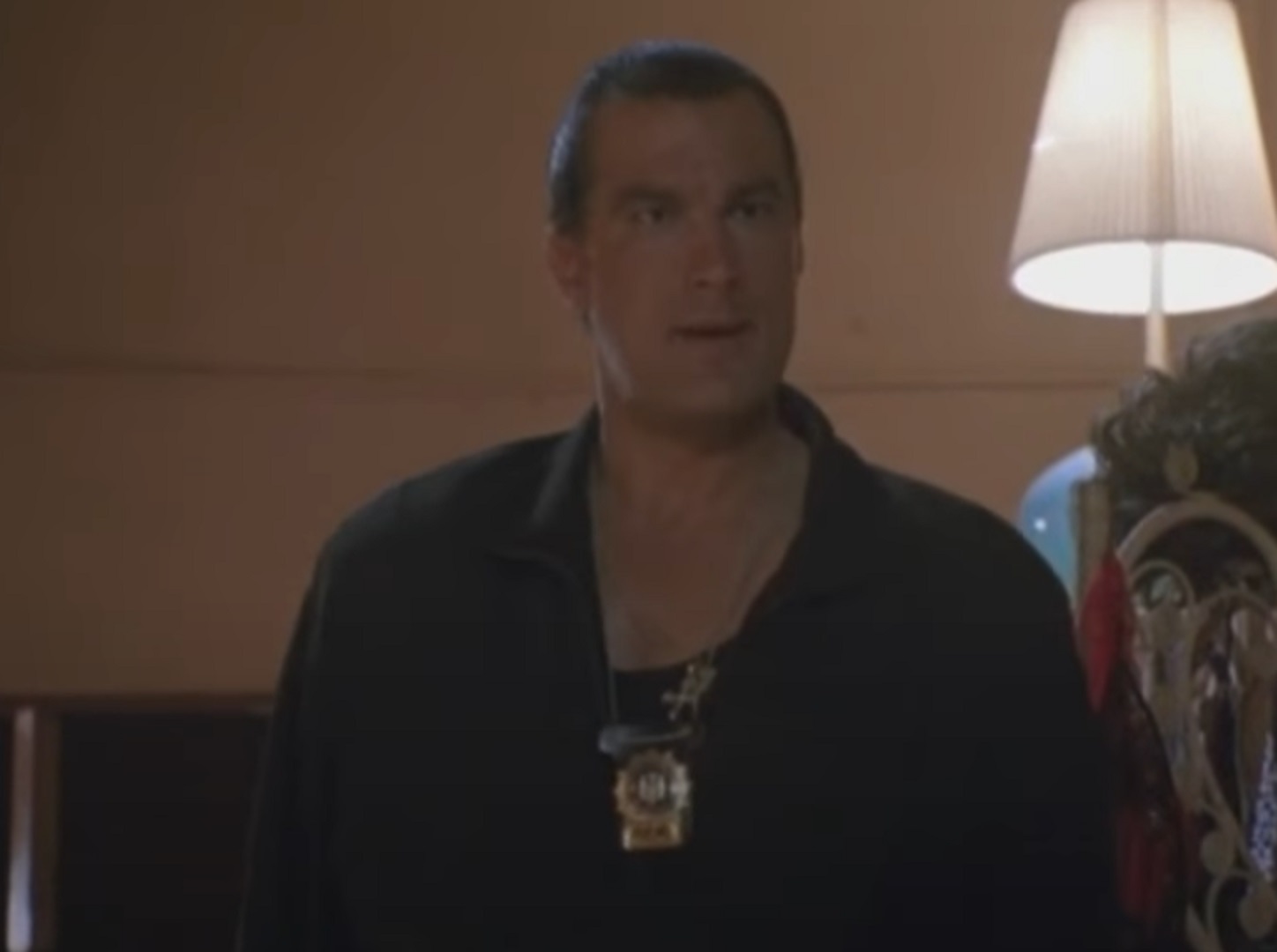 Screenshot: Steven Seagal is looking upset in hotel room - from Out For Justice (1991)