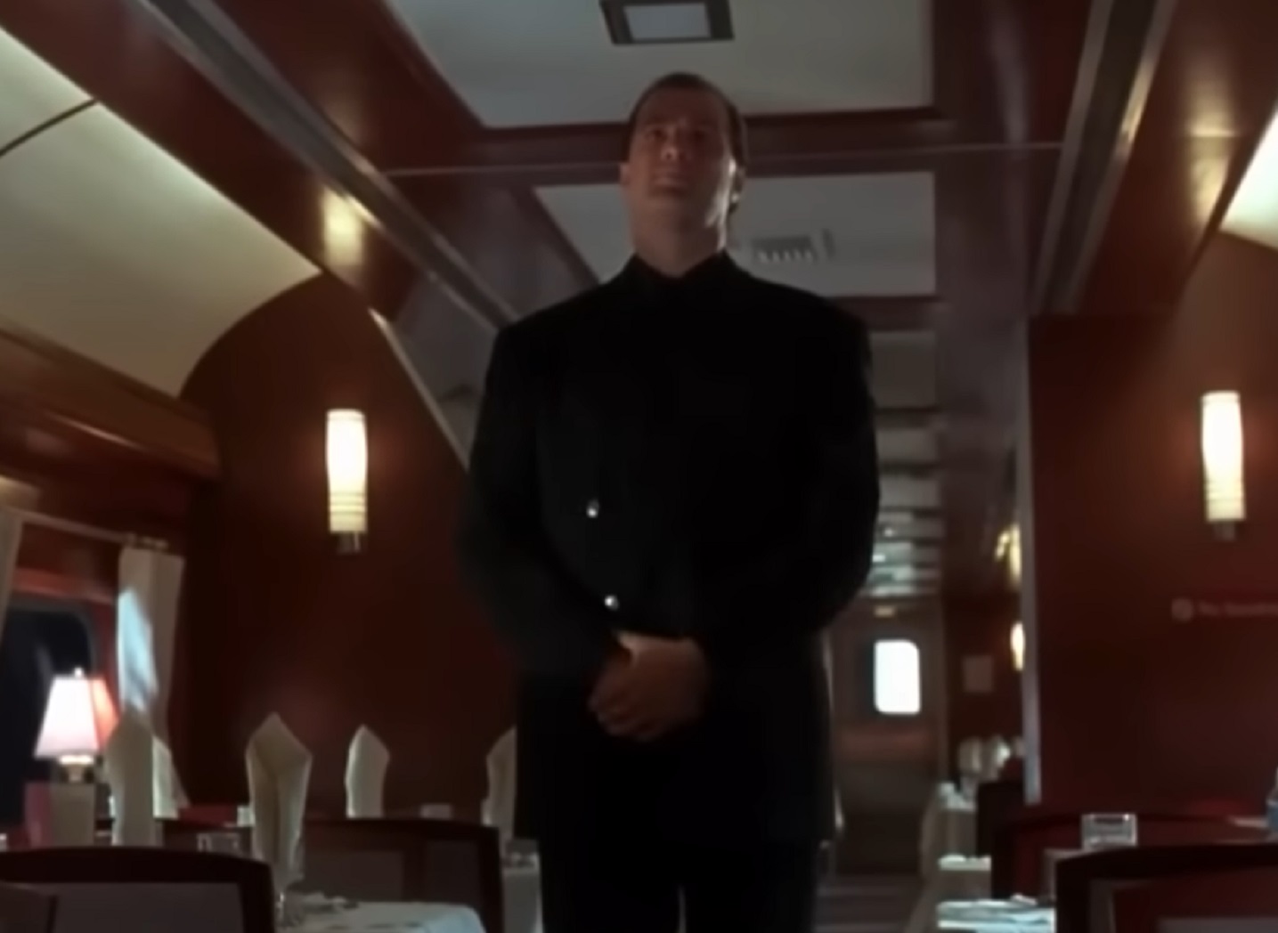 Screenshot: Steven Seagal is standing with crossed arms and looking at front - from Under Siege 2- Dark Territory