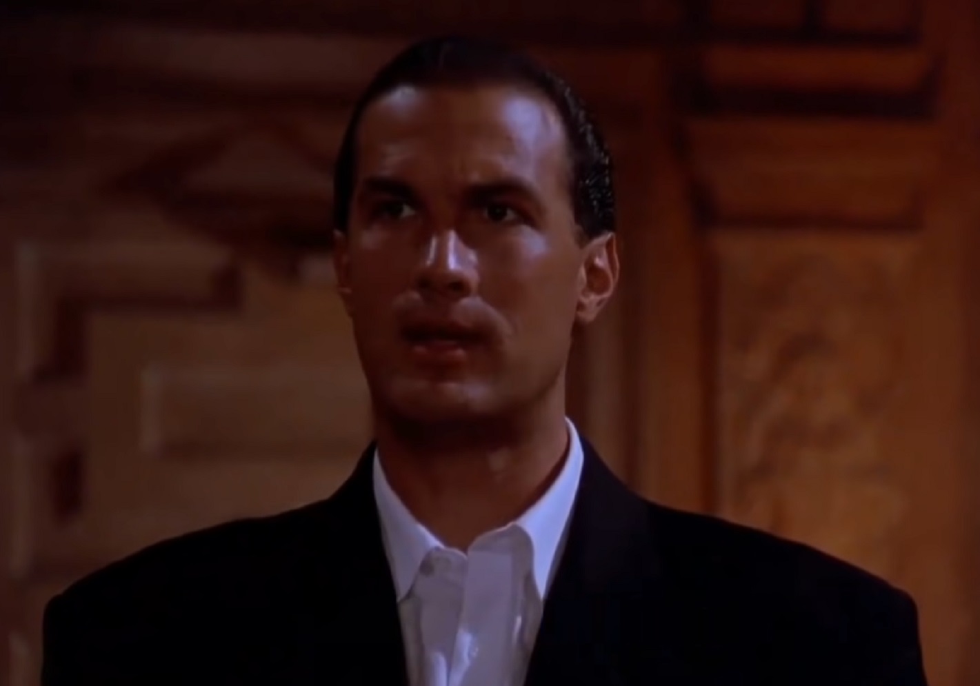 Screenshot: Steven Seagal is looking at side - from Hard To Kill (1990)