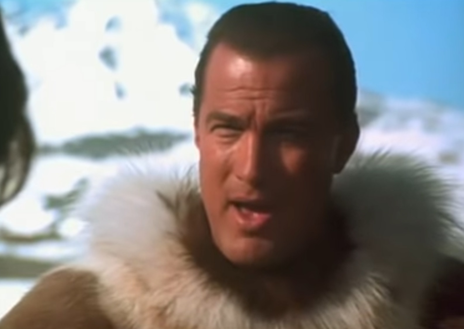 Screenshot: Steven Seagal is standing outside an talking  - from On Deadly Ground (1994)