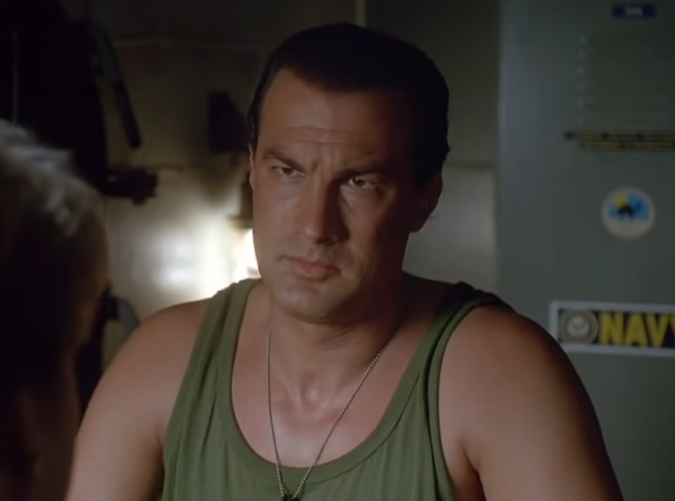 Screenshot: Steven Seagal wearing green military shirt - from Under Siege (1992)